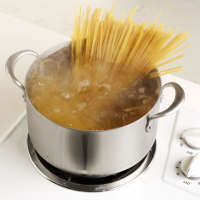 spaghetti in a pot of boiling water